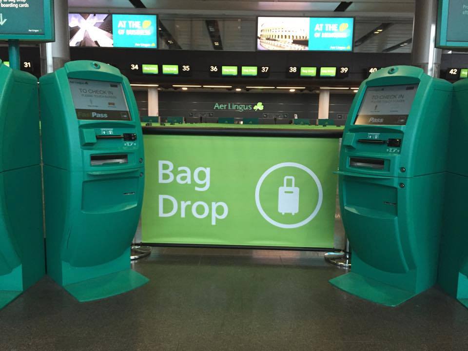 Q-Banner Custom Stanchion Signs Bag Drop in an Airport