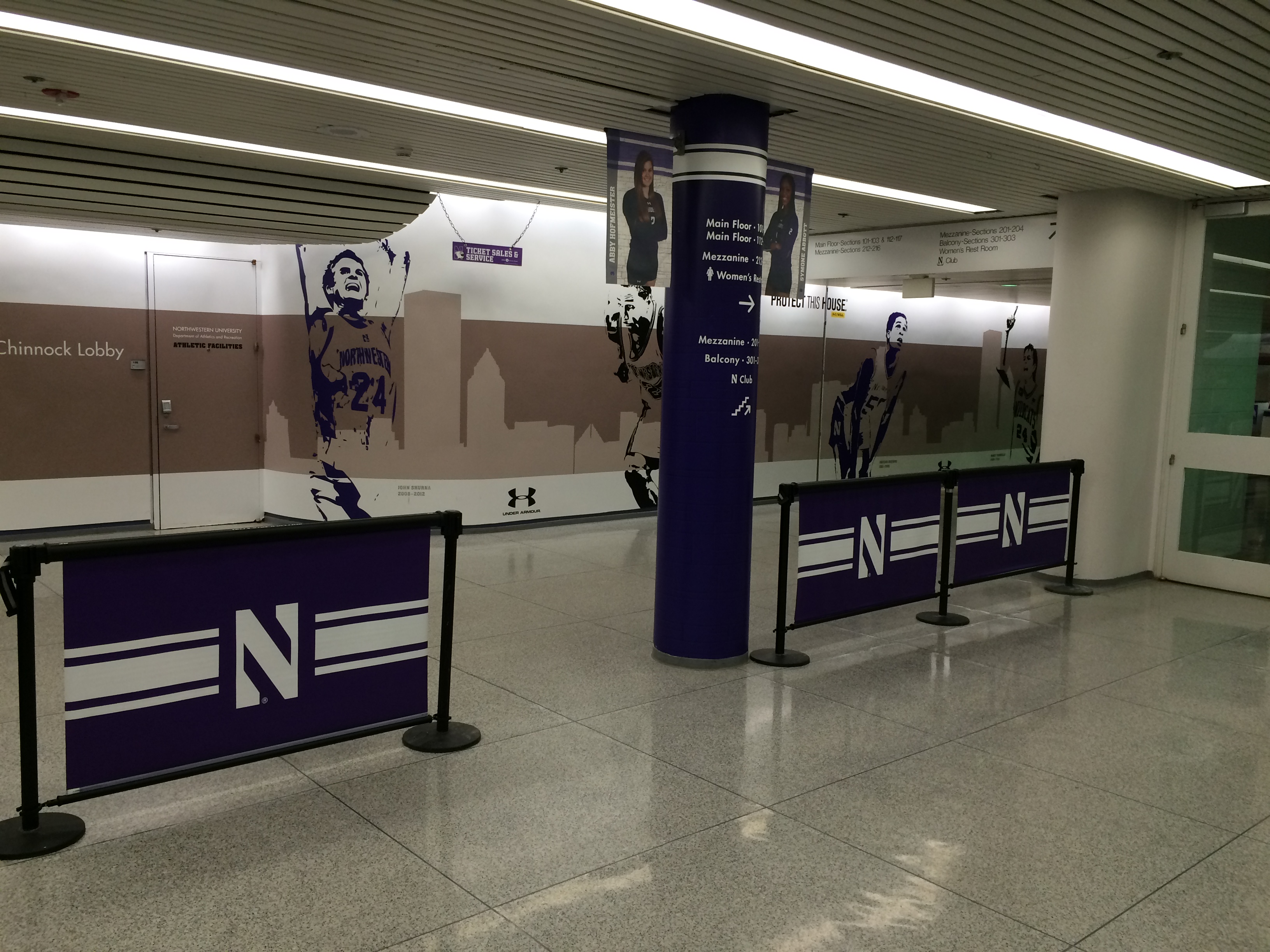 Q-Banner Retractable Belt Stanchion Queue Post Advertising System on Display at Northwestern University